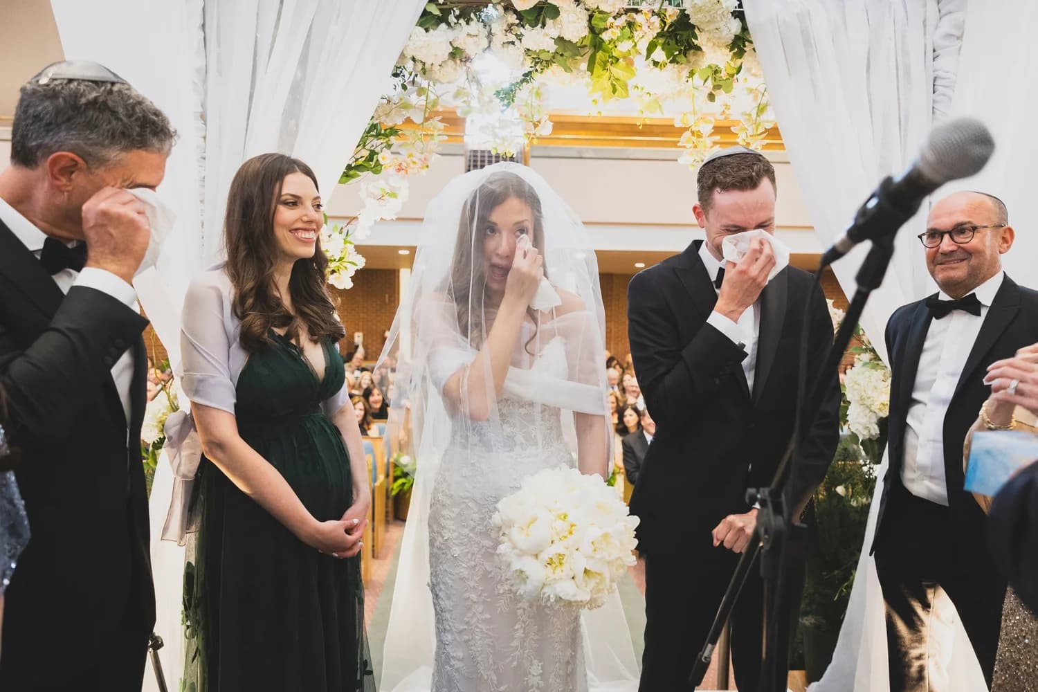A couple embracing during their wedding.
